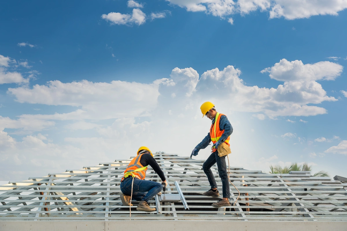 workers building new commercial roof