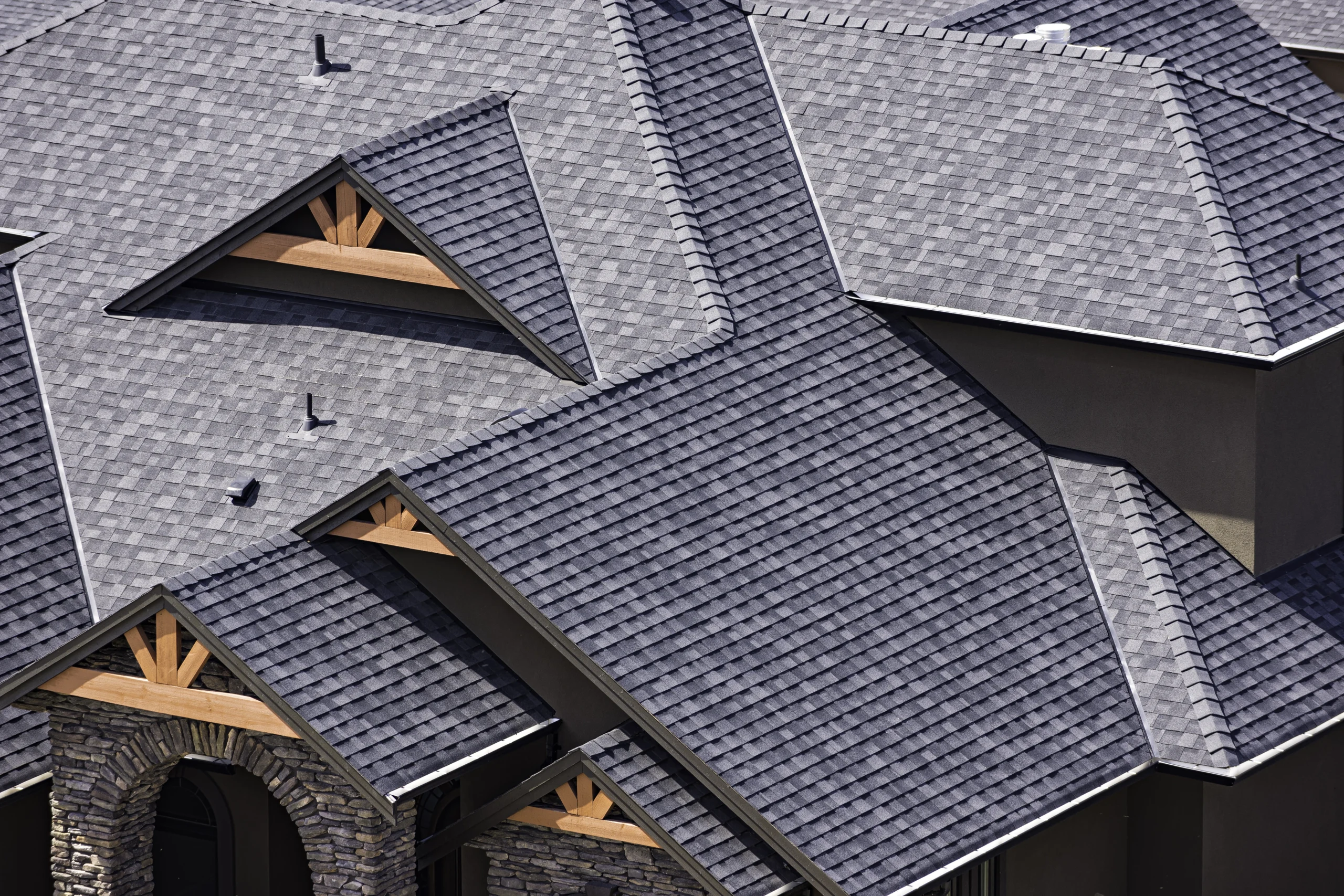 dark shingle roof of large house