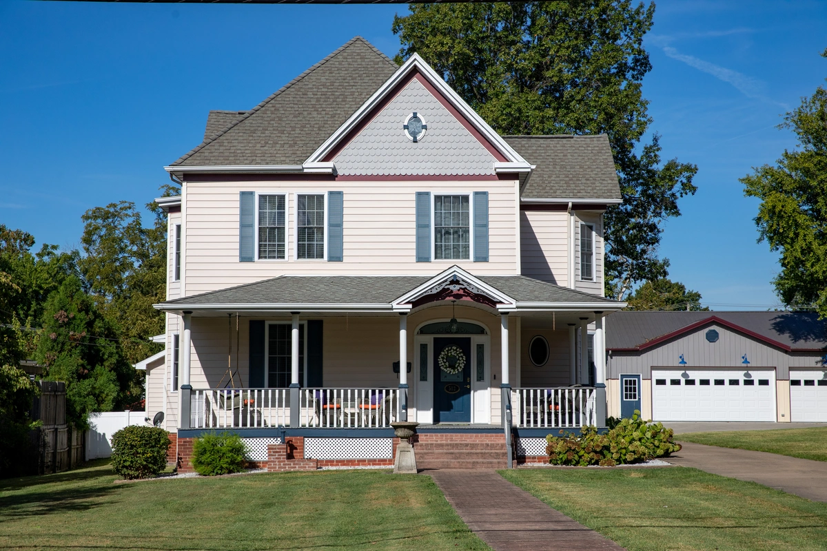 small suburban house with shingle roof