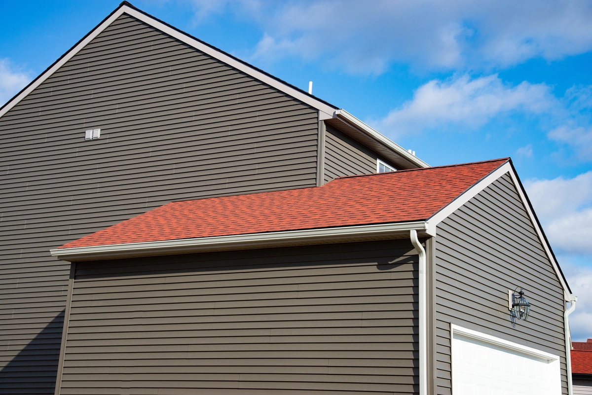 house siding and repaired garage roof