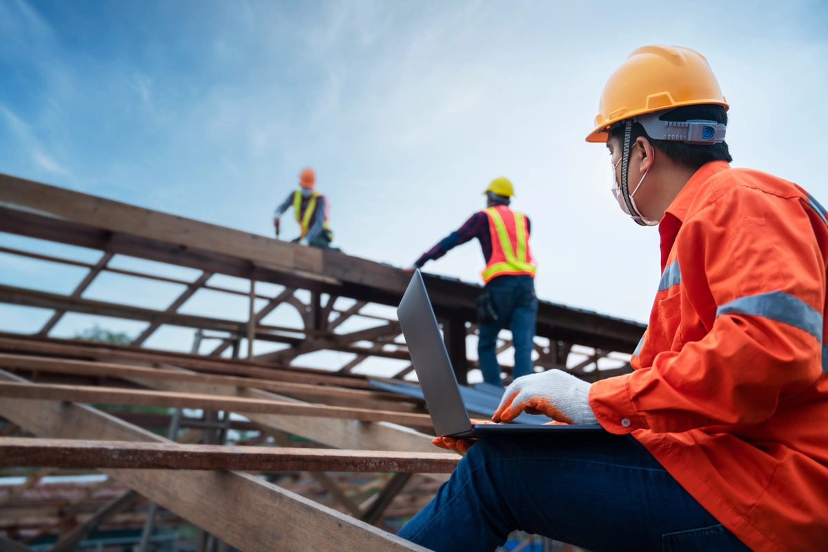 workers building new residential roof