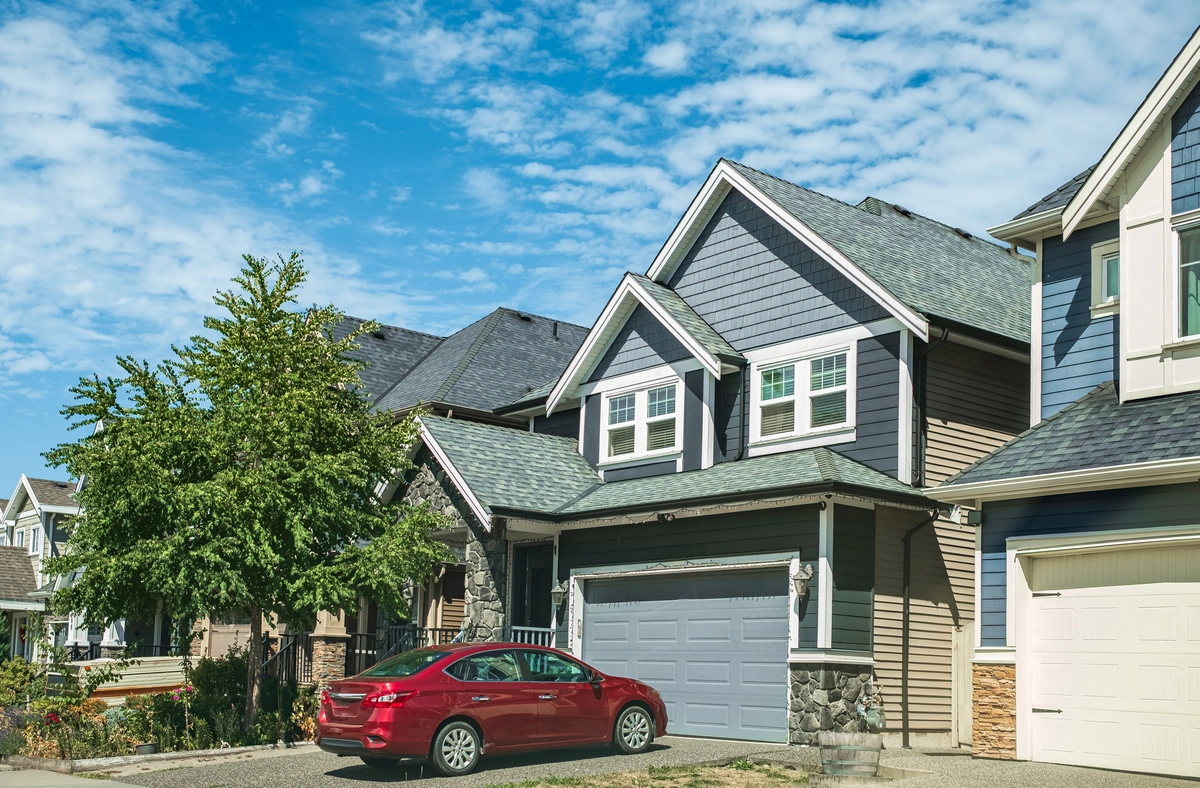 suburban houses with new roof on garage