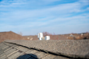 A close view of ridge cap shingles of a roof