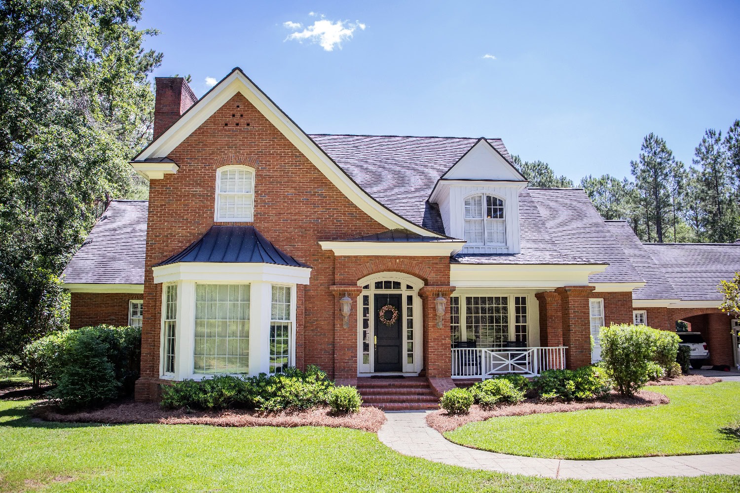 an example of how to choose roof color for red brick house