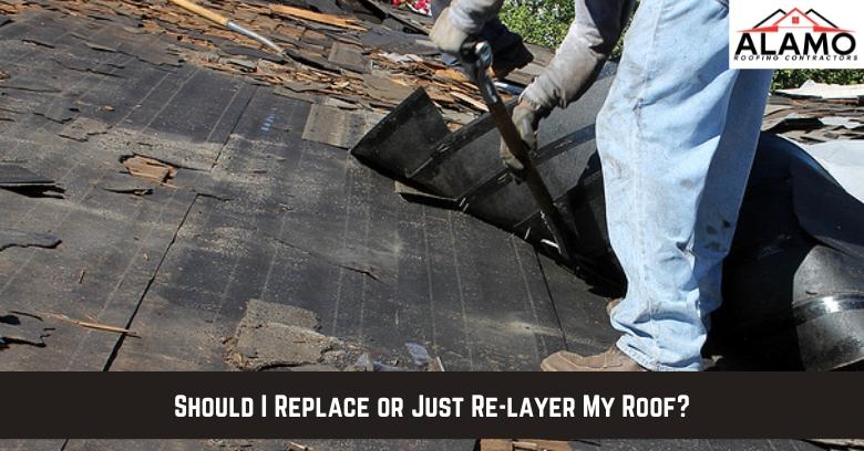 A worker removes old shingles from a roof with visible damage. Text reads: Should I Replace or Just Re-Layer My Roof? Alamo Roofing Contractors logo is in the corner. A worker removes old shingles from a roof with visible damage. Text reads: Should I Replace or Just Re-Layer My Roof? Alamo Roofing Contractors logo is in the corner.