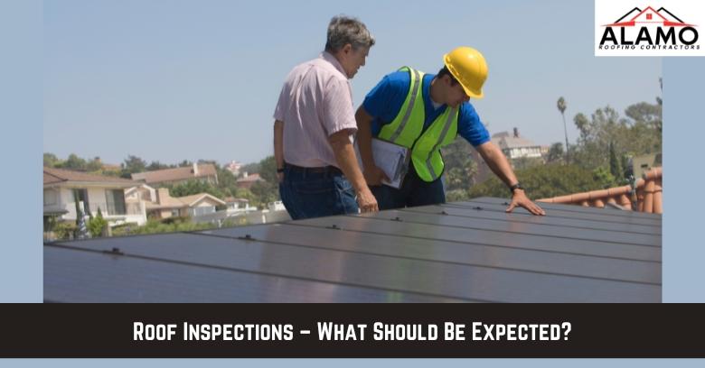 Two men, one in a safety vest and helmet, inspect a rooftop. Houses and trees are visible in the background. The text reads, Roof Inspections – What Should Be Expected?. Two men, one in a safety vest and helmet, inspect a rooftop. Houses and trees are visible in the background. The text reads, Roof Inspections – What Should Be Expected?.